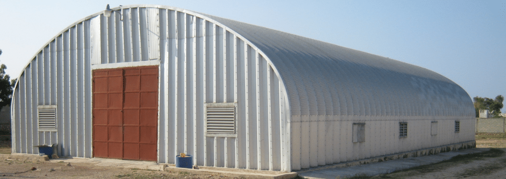 s-model steel building with red double doors