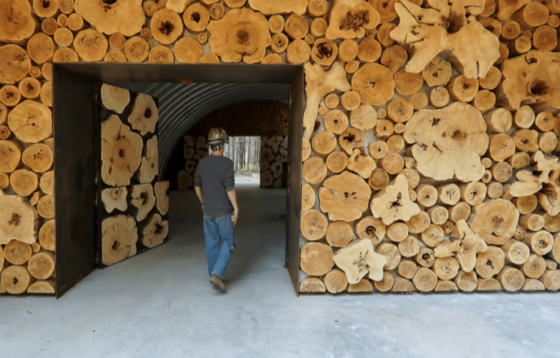 Man walks through workshop door