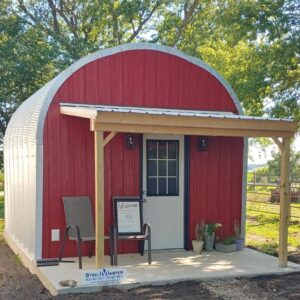 small s model massage studio with custom red front endwall and covered porch