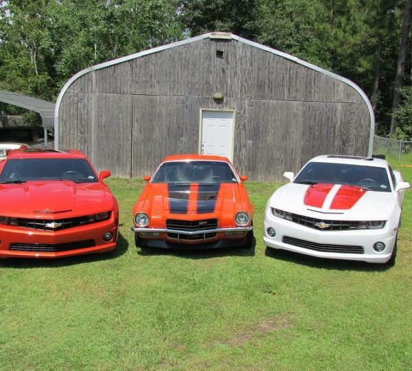 A-Model garage with three vehicles parked out front