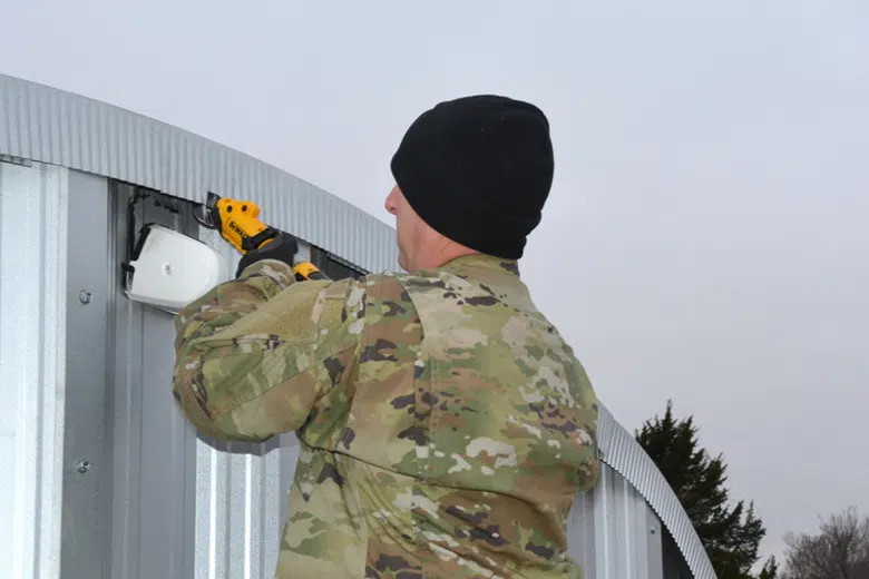 Reserve engineer putting the finishing touches on a Quonset hut at Oklahoma Air Force Base.